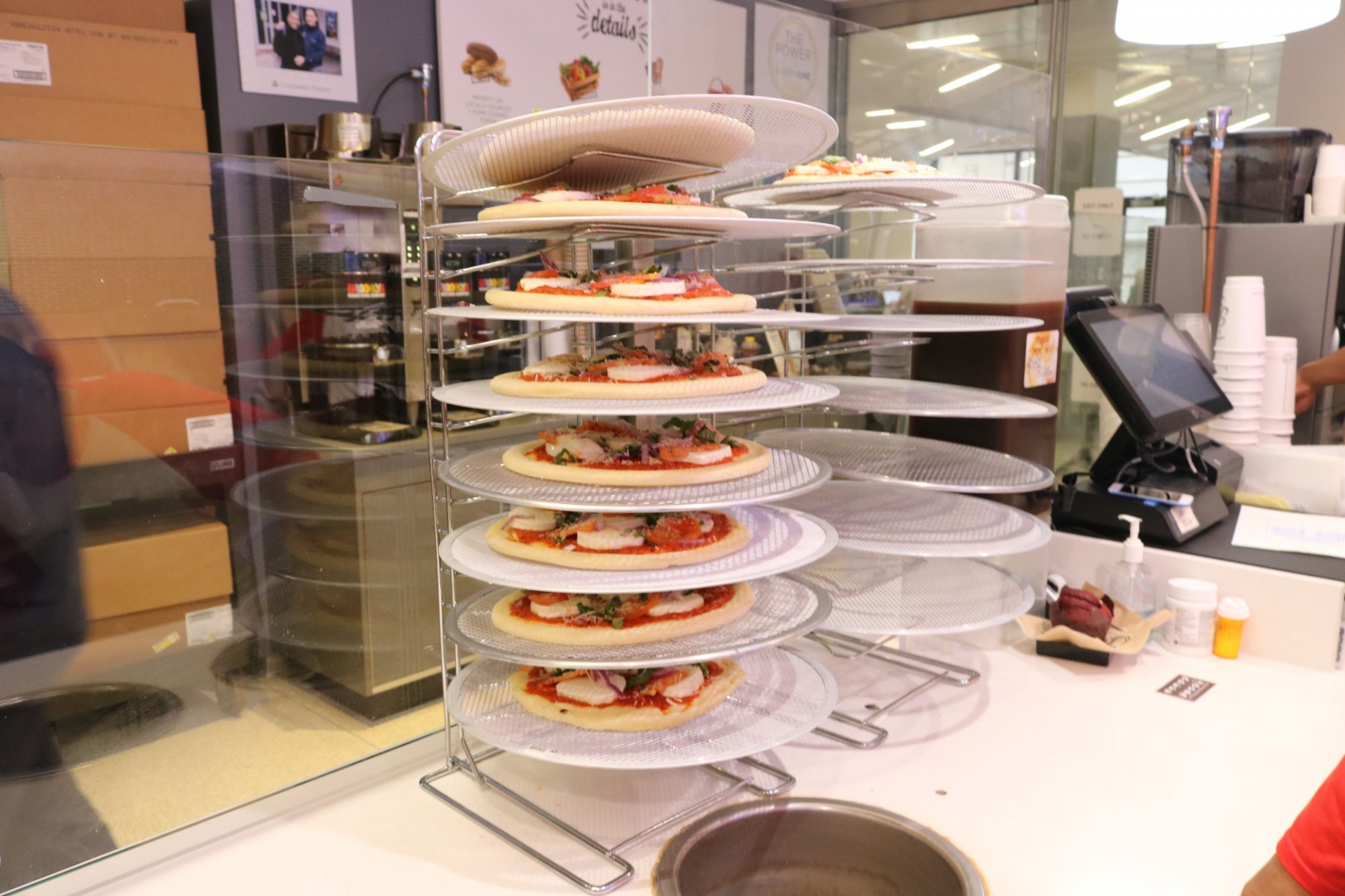 Pizzas on display at the counter