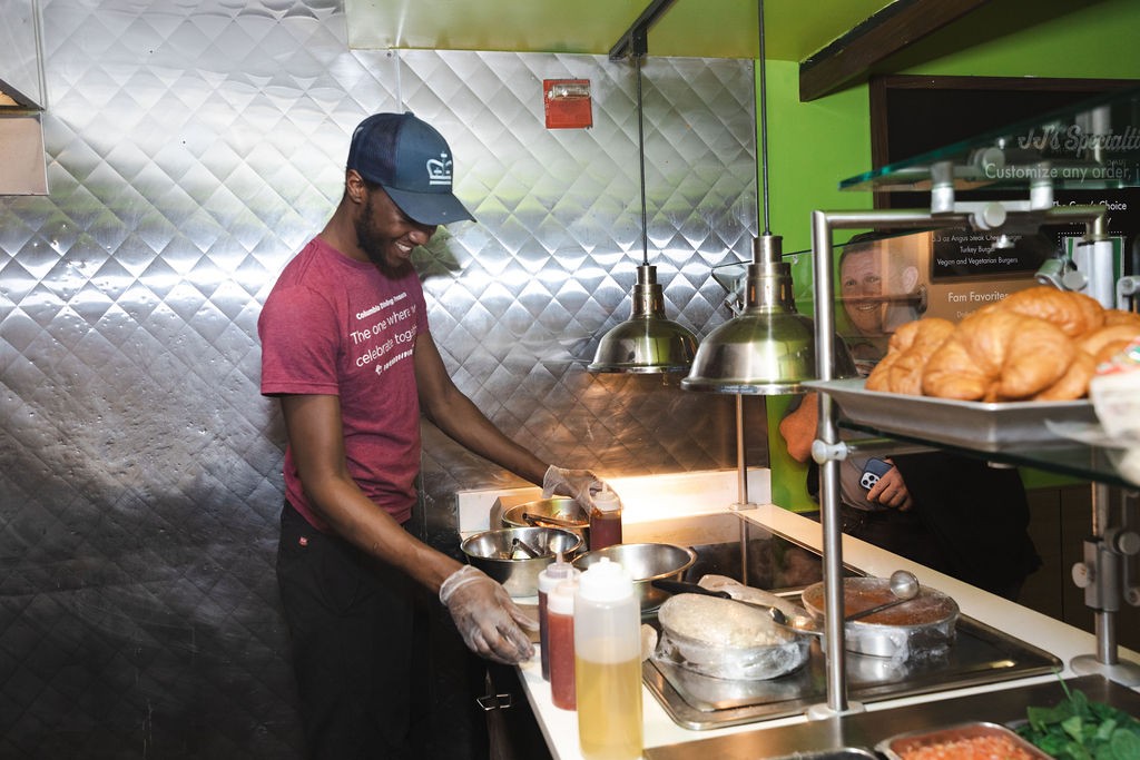 Leon on the JJ's team prepares Beyond Chicken tenders with options like BBQ Sauce, Thai Sweet Chili Sauce and Frank’s Red Hot Sauce Leon on the JJ's team prepares Beyond Chicken tenders with a variety of sauces