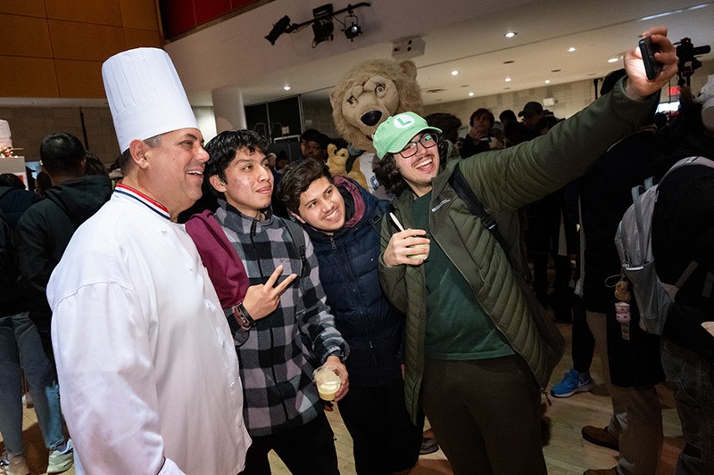 Students taking a selfie with Chef Mike