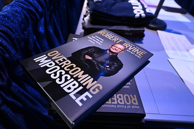 A stack of Robert Irvine's book: Overcoming Impossible