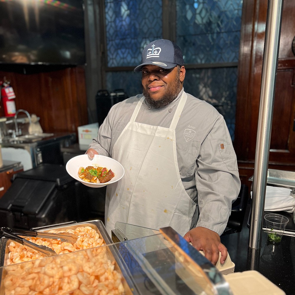 Amin with the plated seafood boil