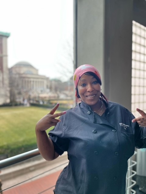 Crystal can't wait to share her home cooking with our students! Crystal standing in Ferris