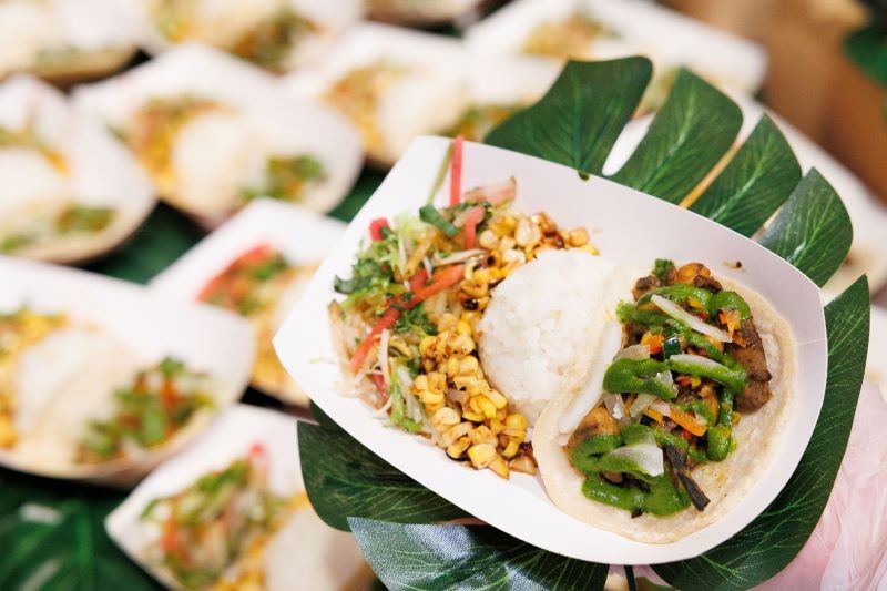 Madras taco on a corn tortilla with coconut rice