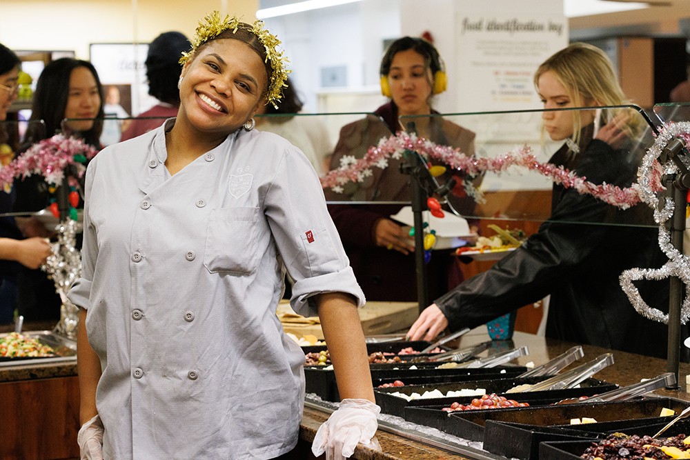 Is it just us, or does Gleiny's tinsel crown almost look like a halo? Gleinys standing behind the salad bar