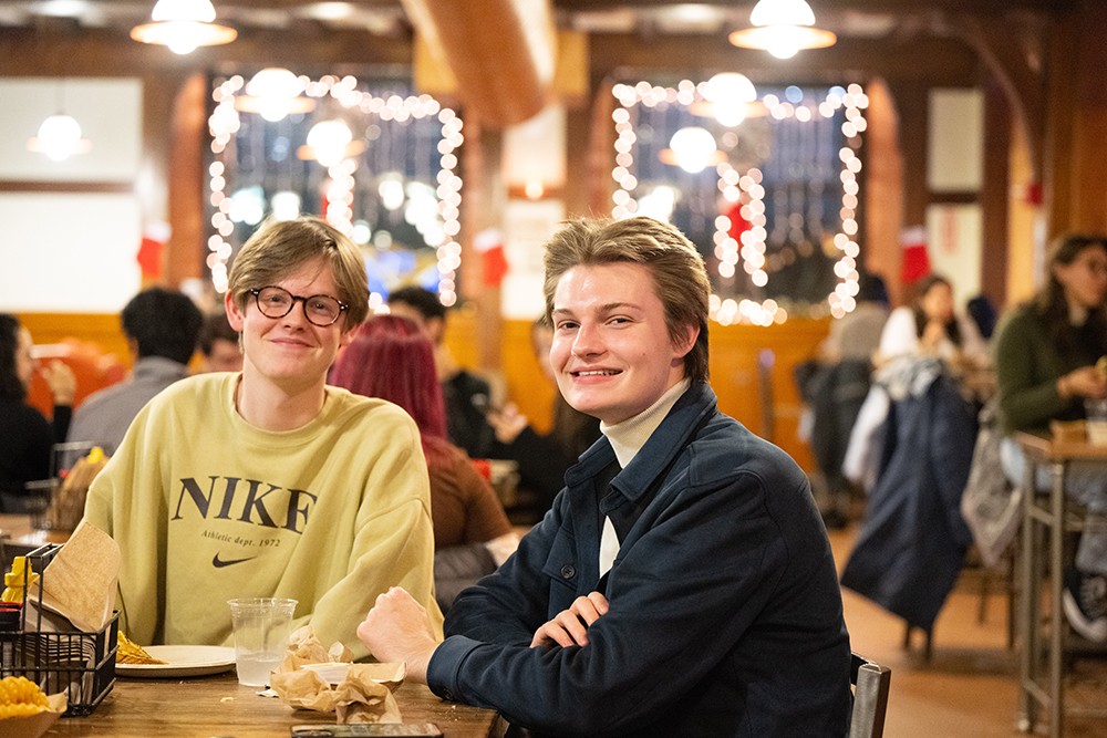 Two students sit in JJ's Place