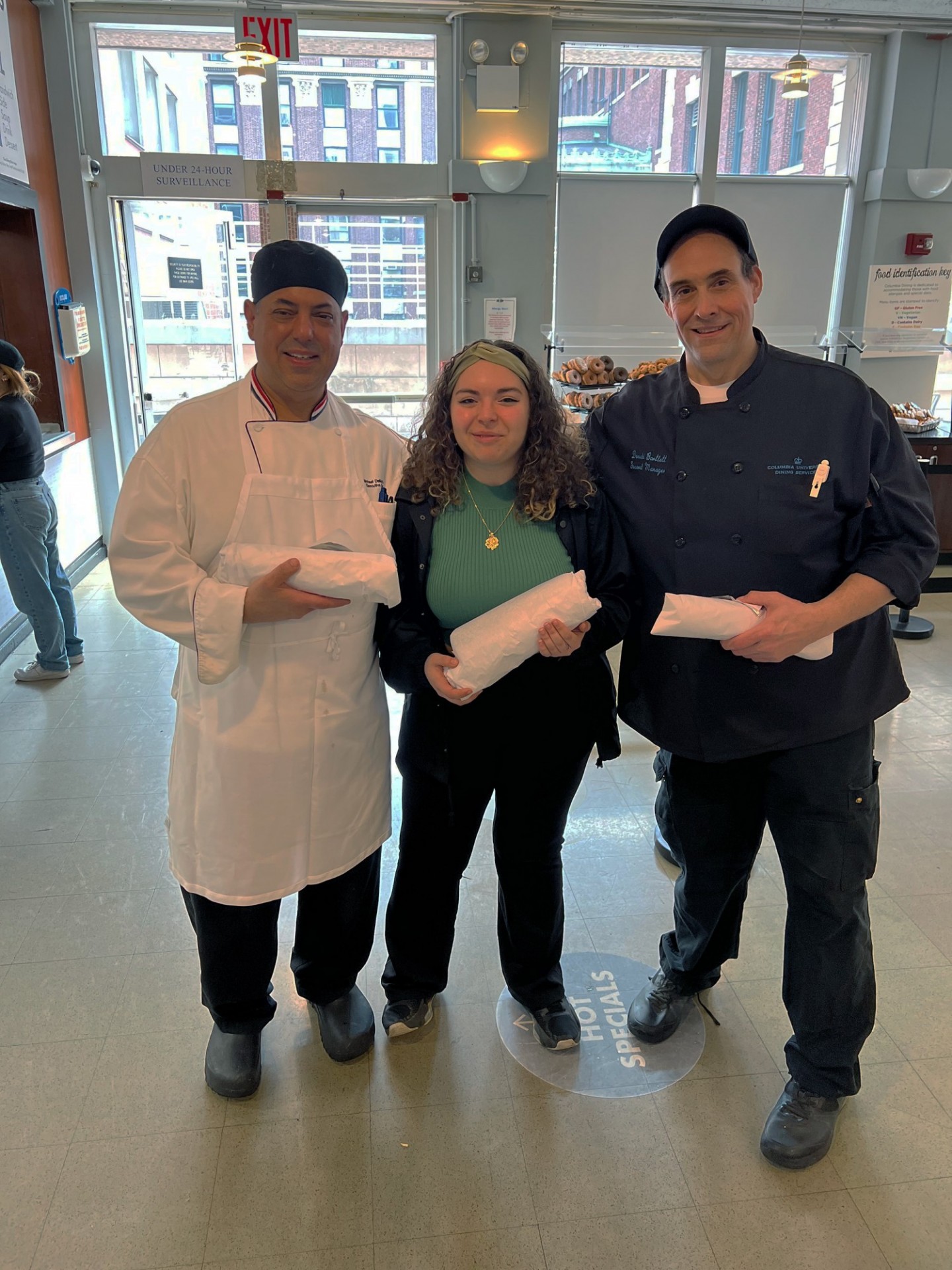 Teamwork makes the dream work. Chef Mike, Katherine and Chef Don holding subs
