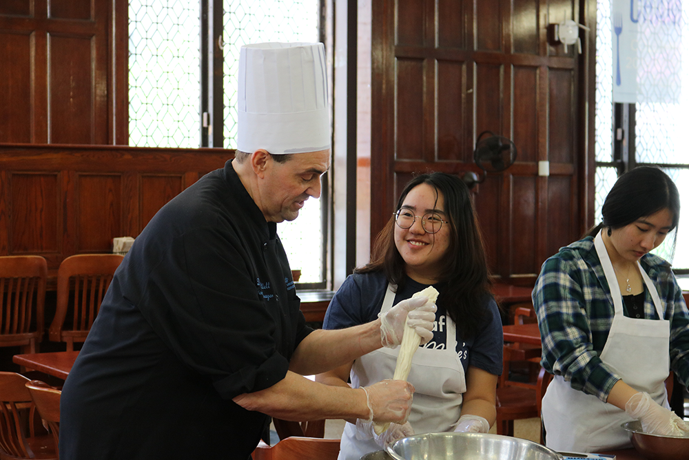 Chef Don demonstrates how to stretch the mozzarella 