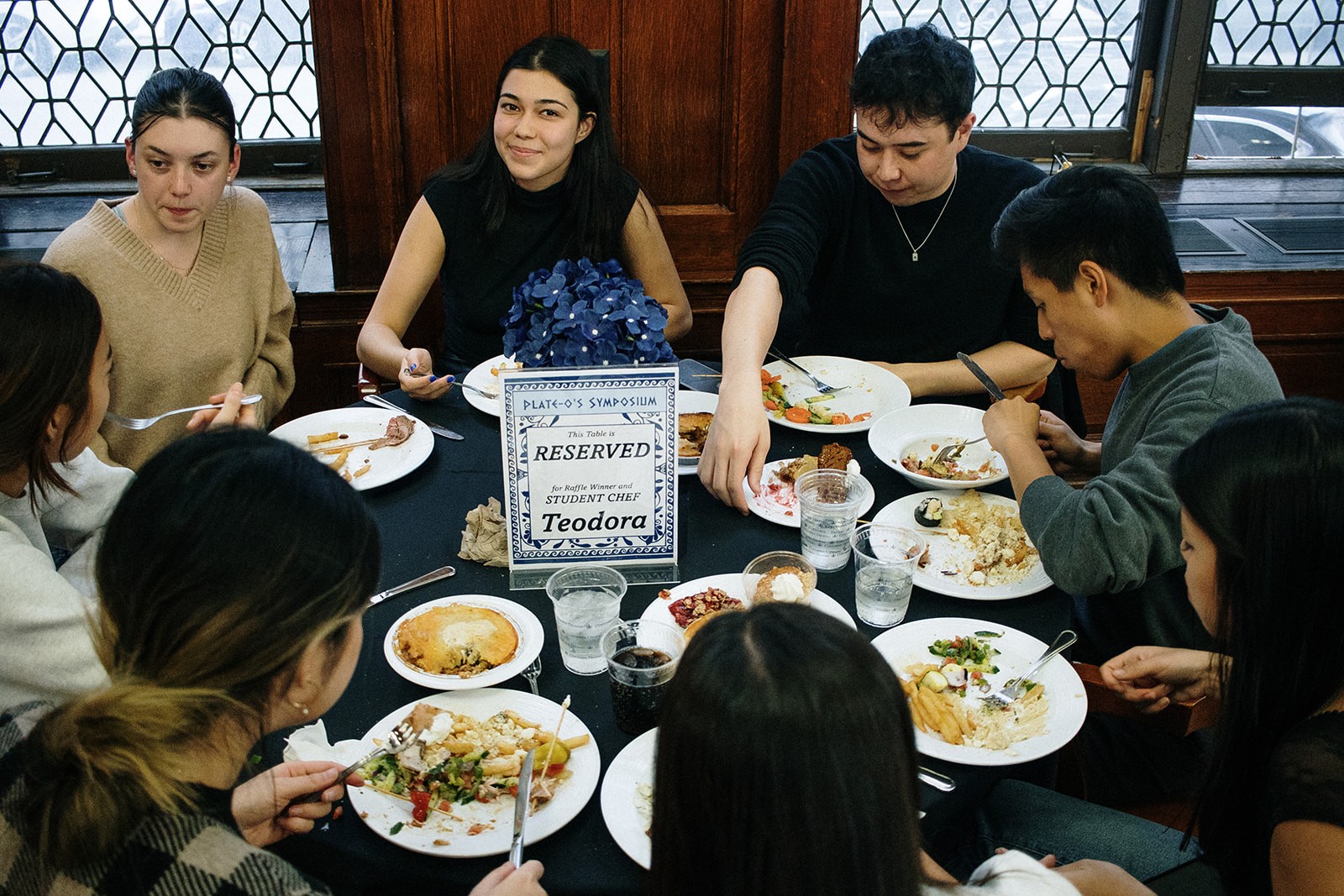 The guest of honor and friends at dinner