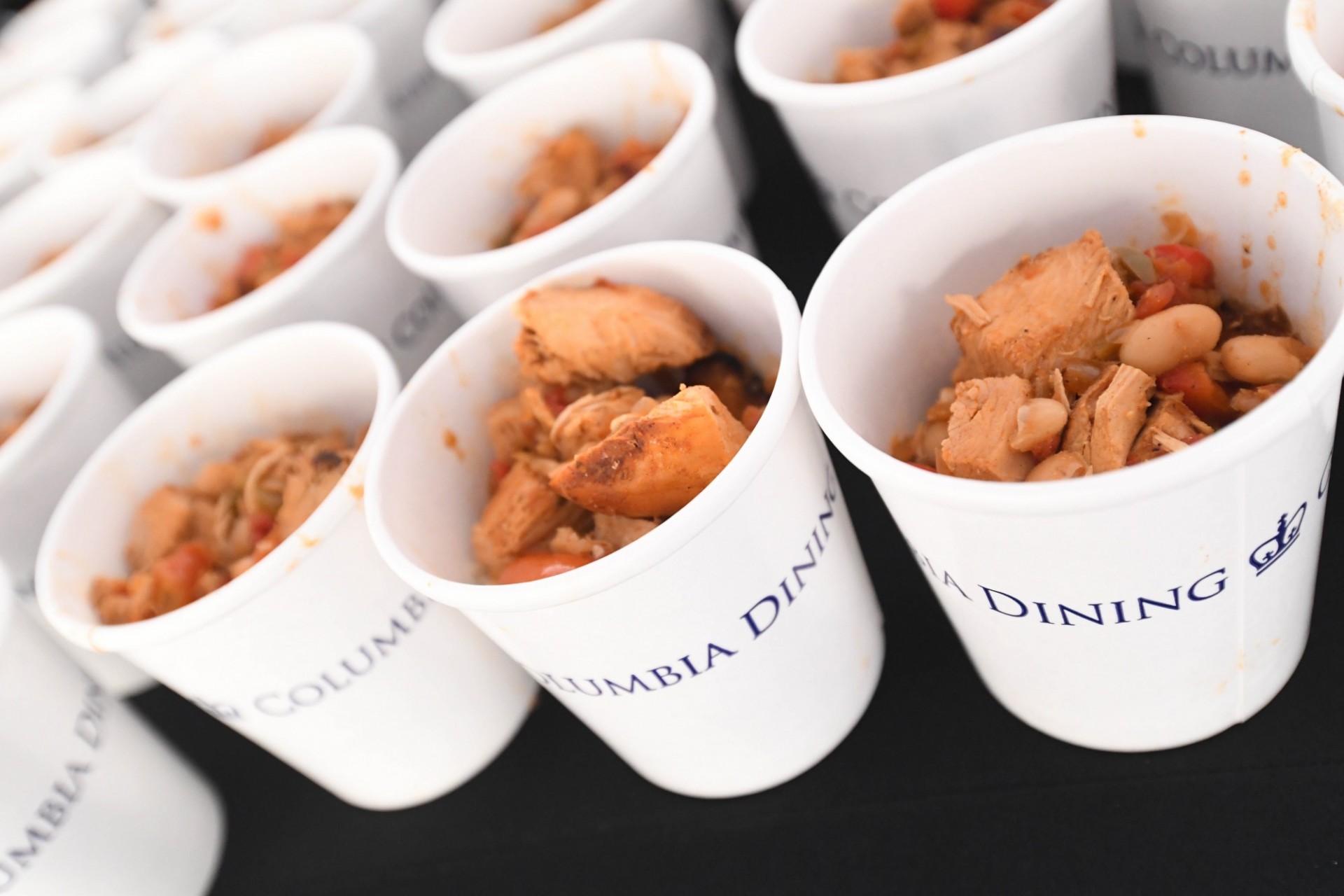 Three types of chili were served, including this halal chicken and white bean chili Rows of cups of halal chicken and white bean chili