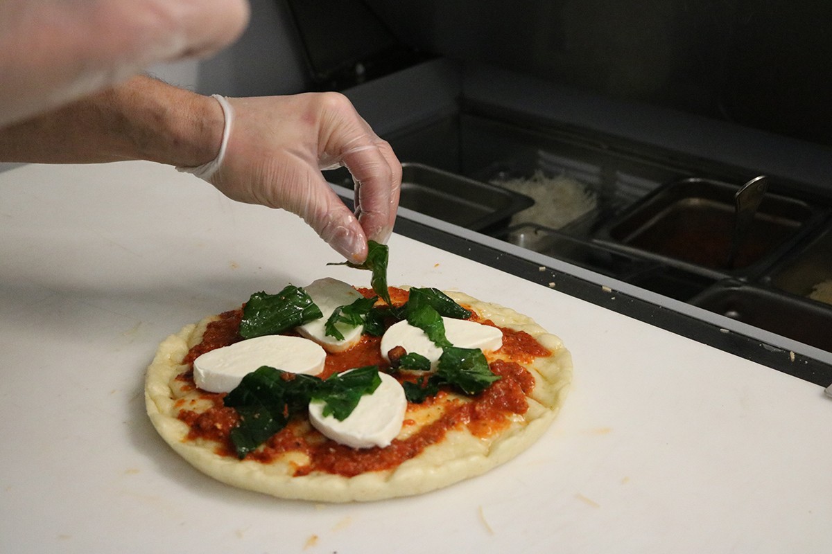 Freshly prepared personal pizzas coming your way!