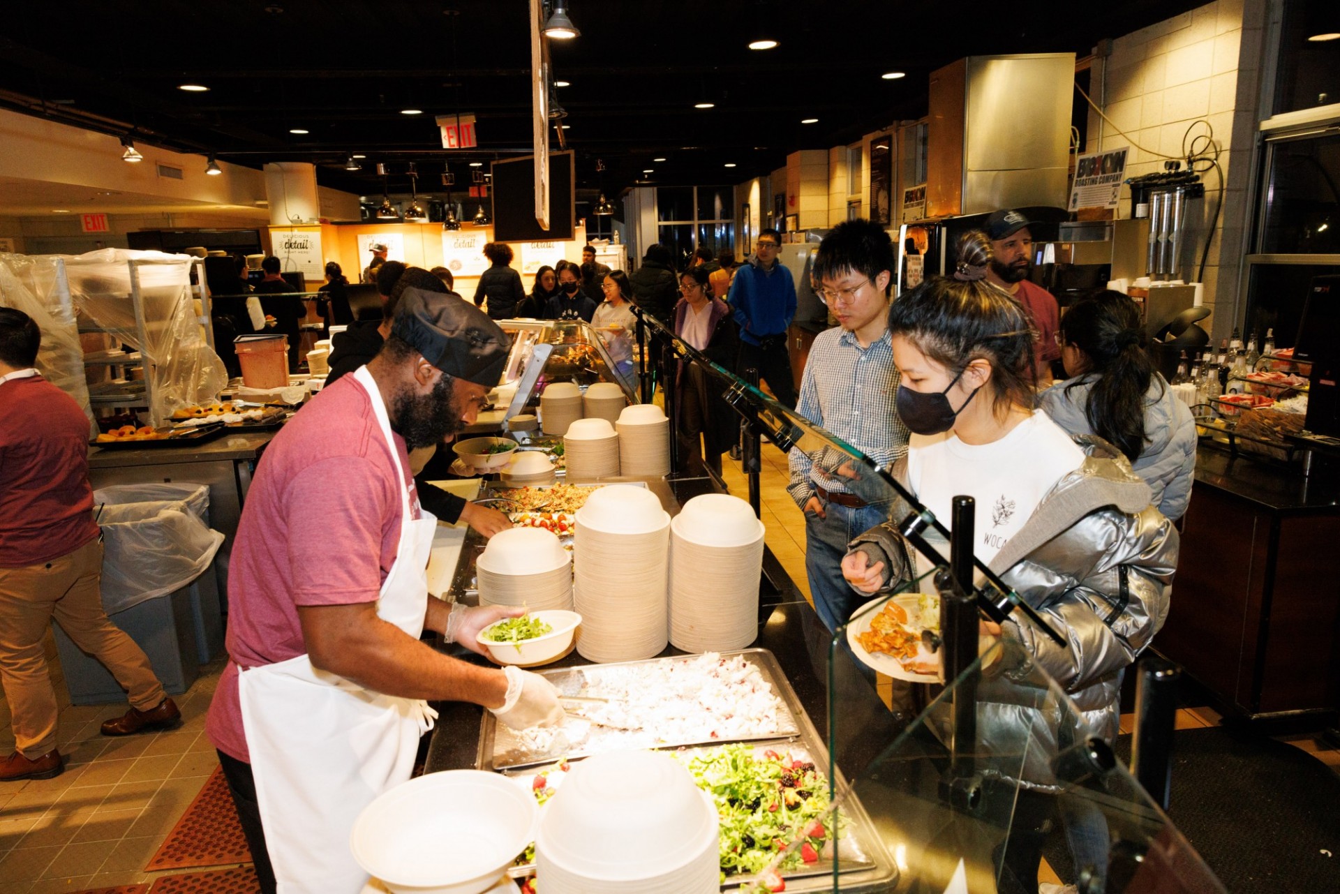 Made-to-order salad station Ferris staff member serving students