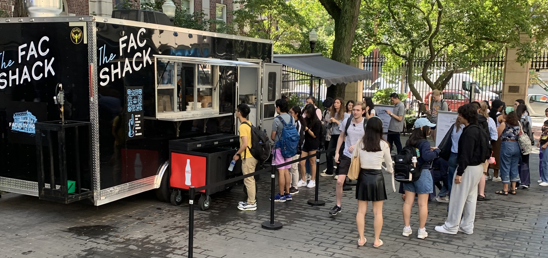 Students line up outside the Fac Shack Food Truck on Wein Courtyard