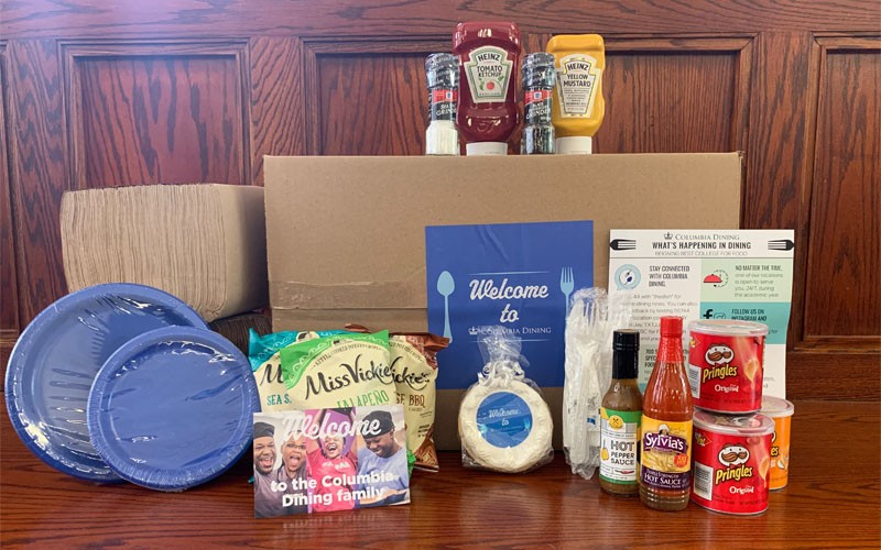 Welcome box containing condiments, disposable flatware, snacks, and more