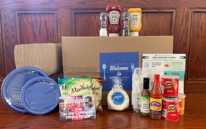 A Welcome to Columbia Dining Box containing condiments, snacks, plates, utensils, napkins, and other mealtime essentials will be waiting in each students' room upon arrival. Welcome box containing condiments, disposable flatware, snacks, and more