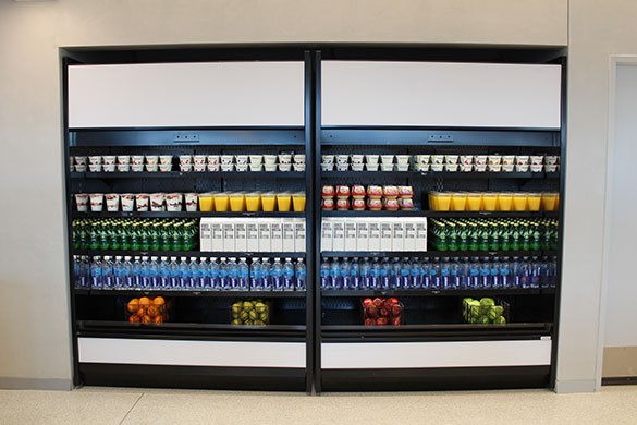 Refrigerator with orange juice, apples, water, yogurts