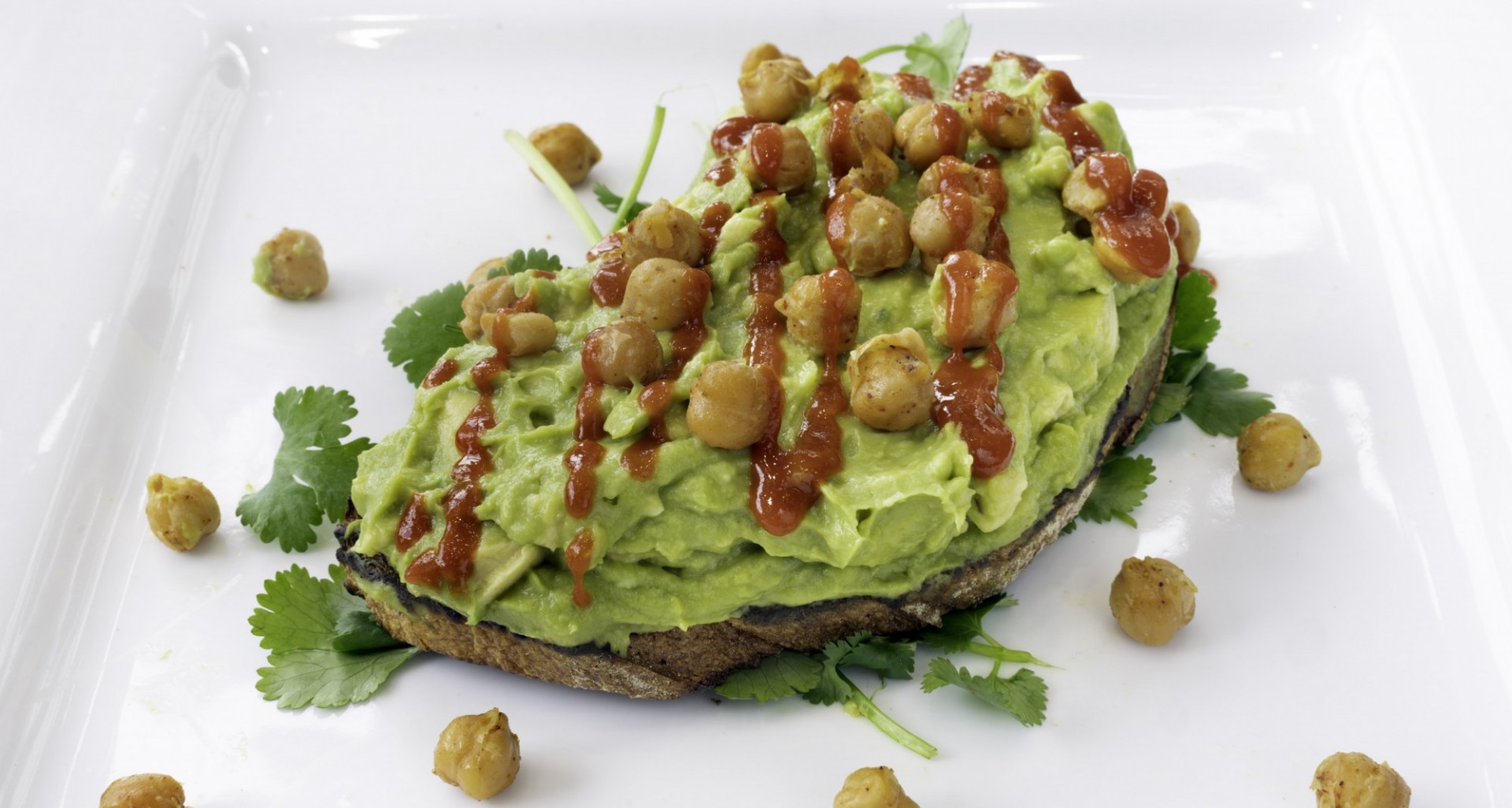 Avocado Toast with Chickpeas and Hot Sauce on Top