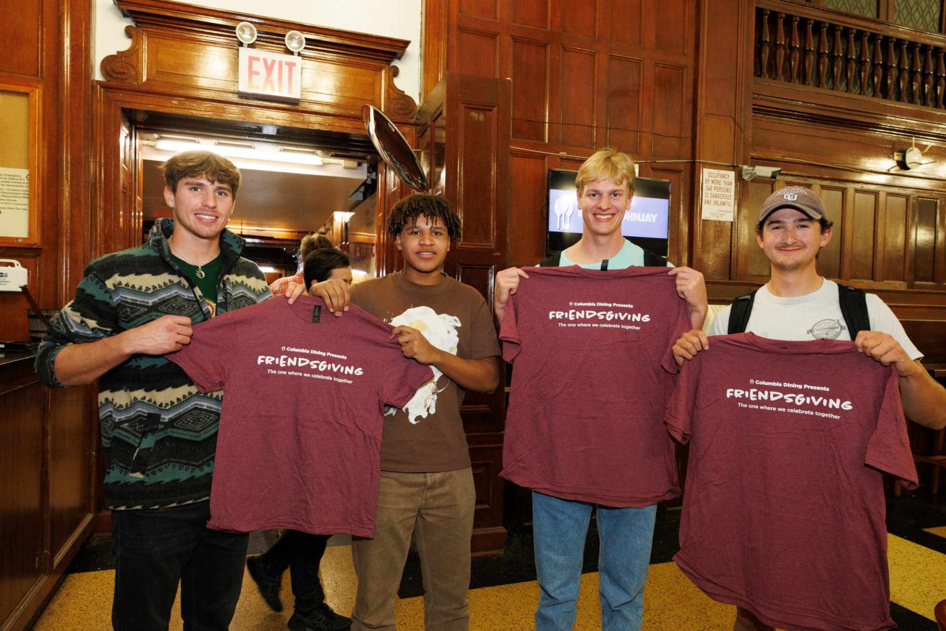 Dope swag, bro students holding up the tee shirts