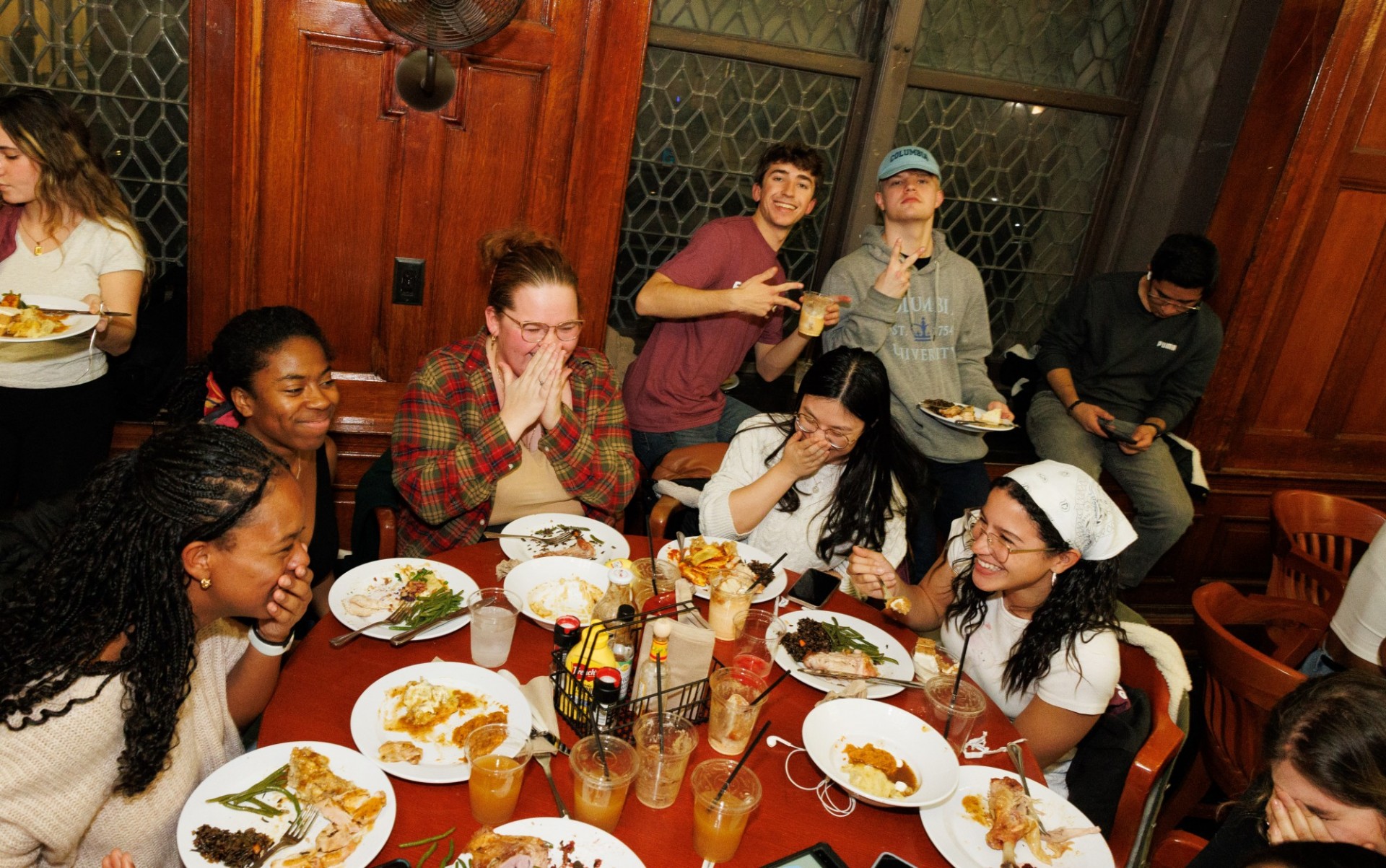 Savoring every bite, one smile at a time students laughing while they eat