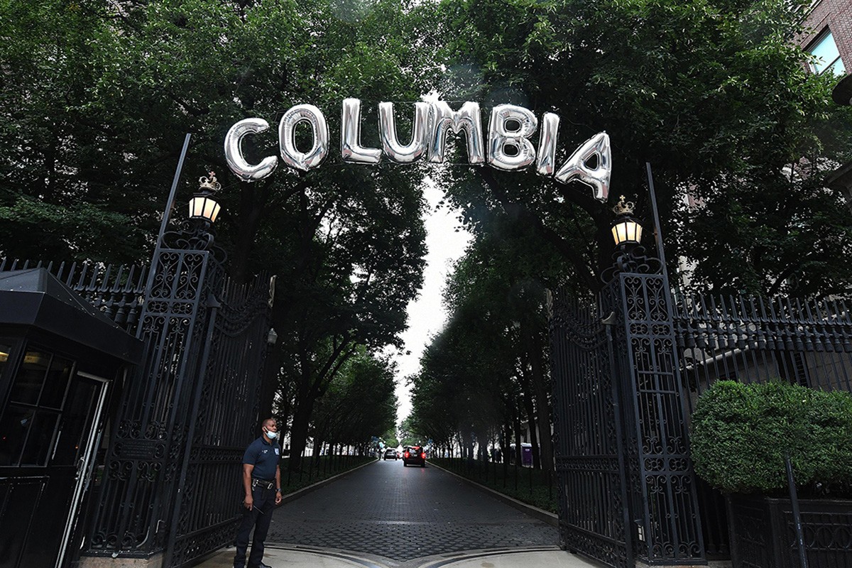 baloons spelling the word "columbia" hang on the Columbia University gates