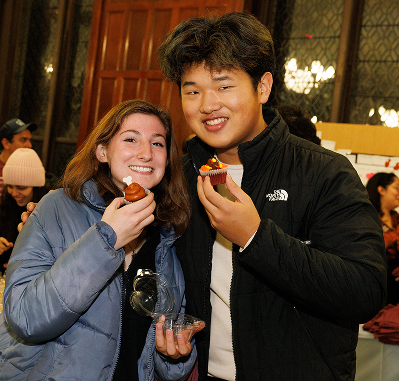 Students were all smiles for these festive sweets! Two students holding cupcakes