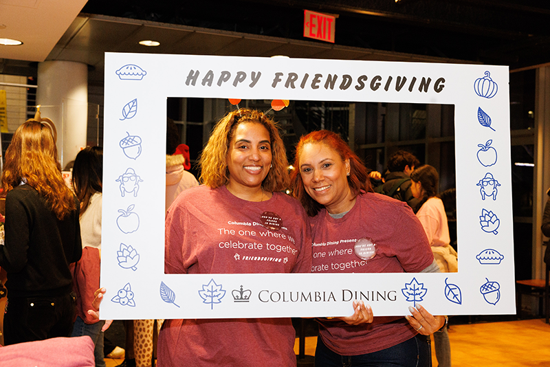 Ferris staff pose with the Friendsgiving photo frame