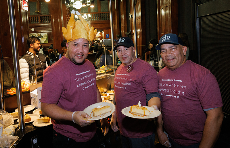 The only thing sweeter than the pumpkin cheesecake are the staff serving them! John Jay staff serve pumpkin cheesecake