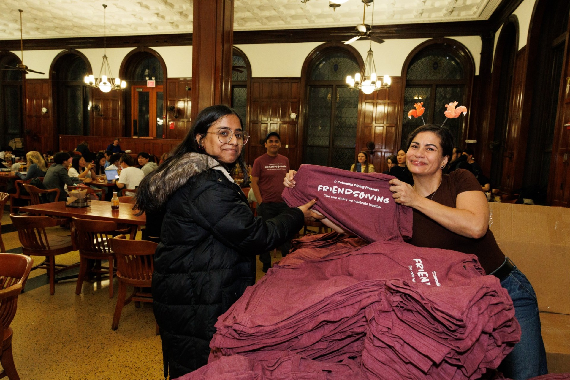 You get a t-shirt, you get a t-shirt, EVERYBODY gets a t-shirt! faculty handing out tee shirts to a students