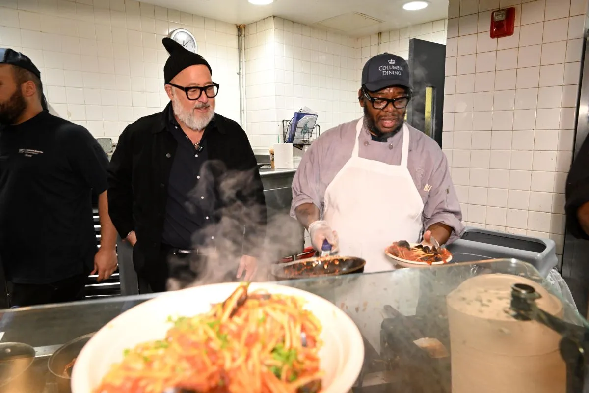 Chef Zimmern watches as staff prepare Mussels Fra Diavolo