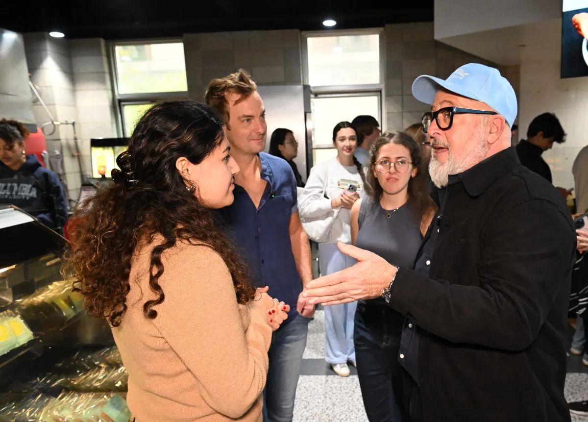 The visiting chefs talk with students