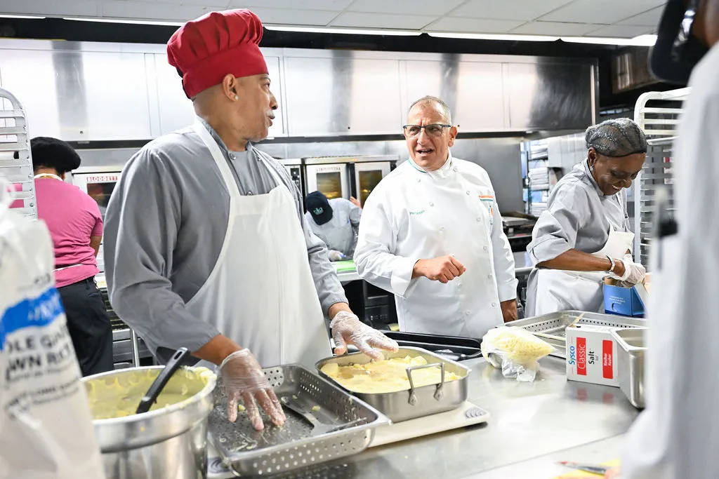 Chefs in kitchen talking
