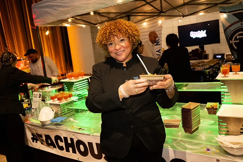 Staff holding a plate of food