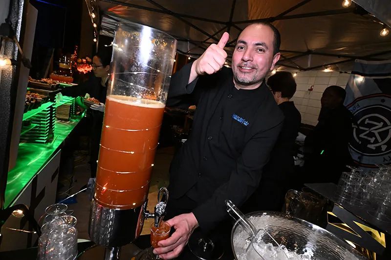 Staff pouring drinks