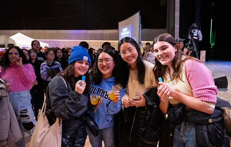 Students holding raffle tickets