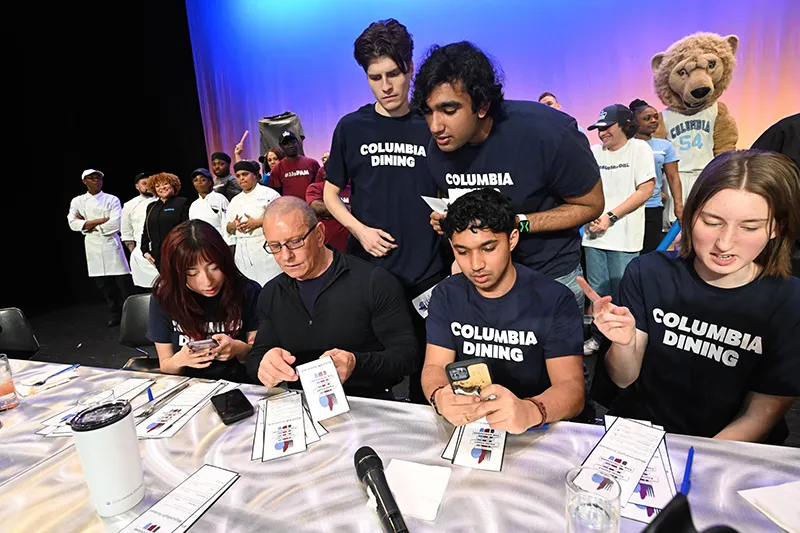 Judges deliberating and calculating scores for the competition winner