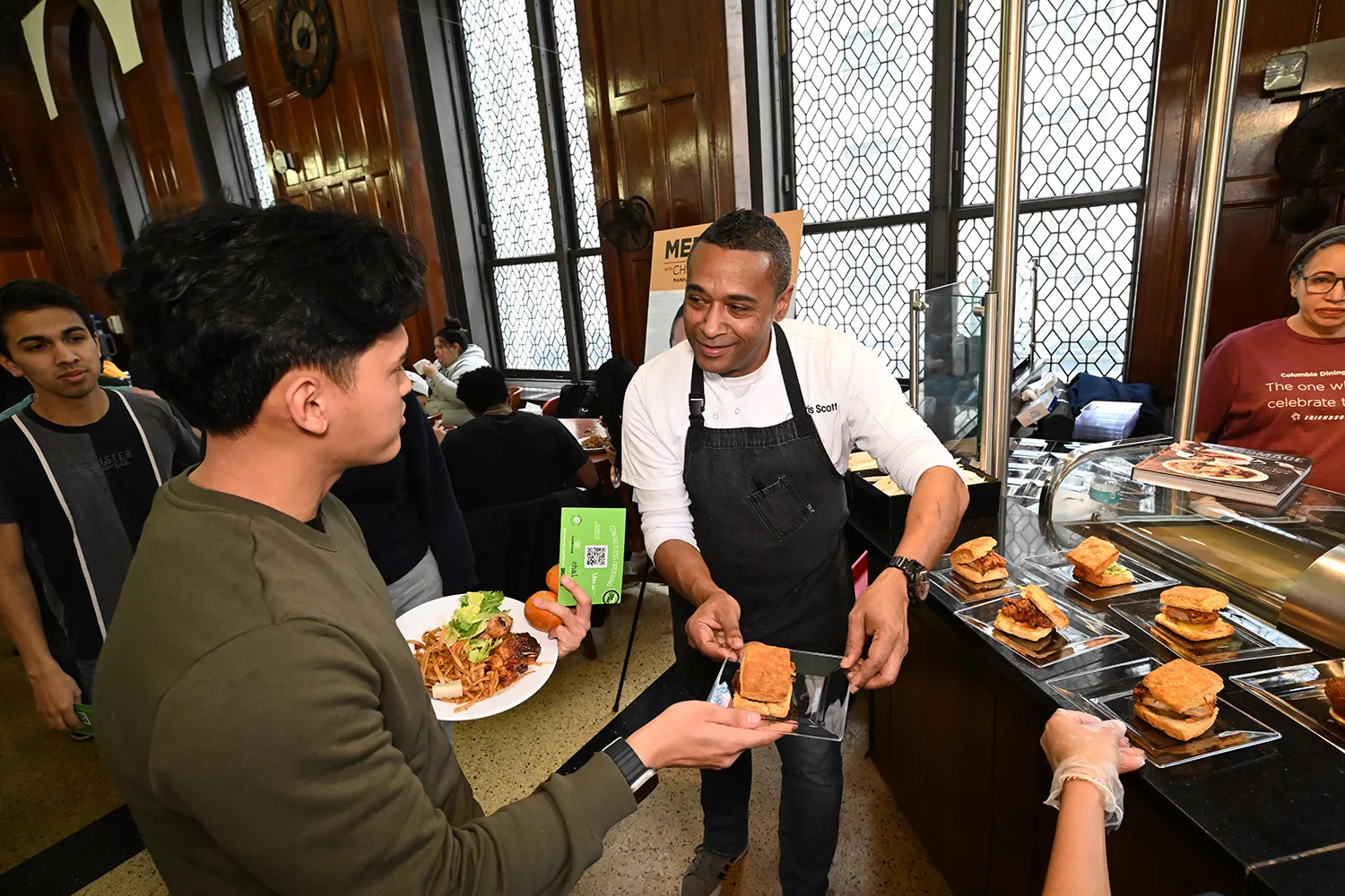 Chef Scott serving sandwiches