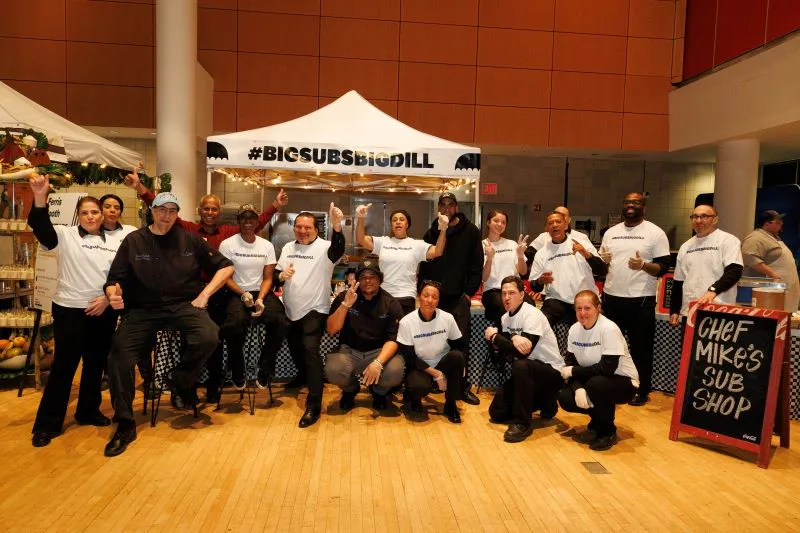 Chef Mike's Sub Shop staff in front of their tent