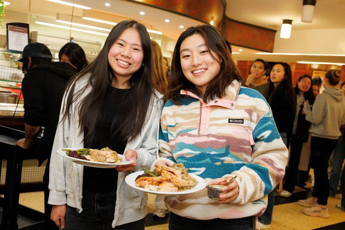 Students holding plates of turkey