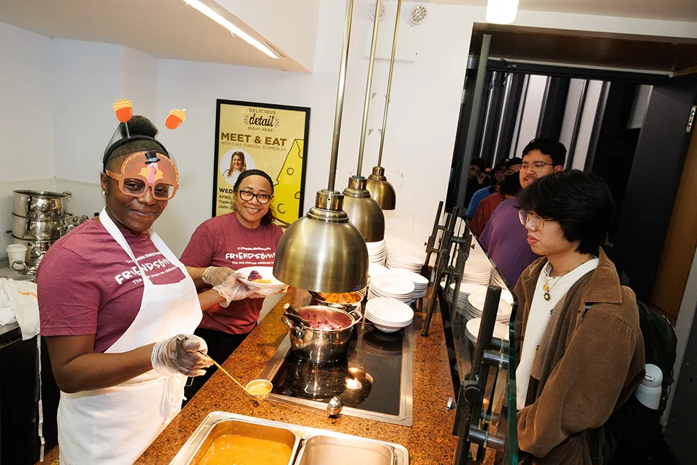 Staff serving mashed potatoes
