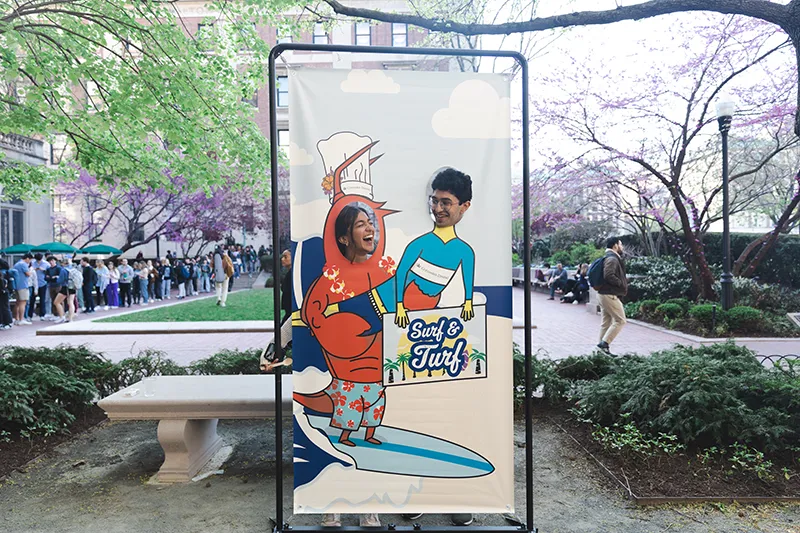 Students looking at each other at the photo booth