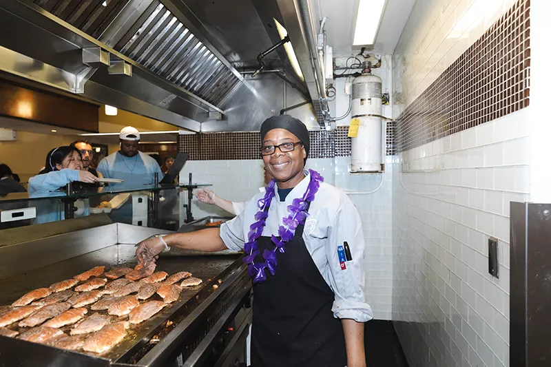 Jan cooking salmon at the John Jay grill