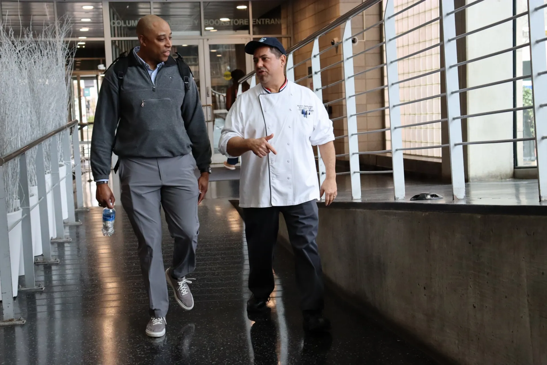 Chef Mike walking with an Army representative through Lerner
