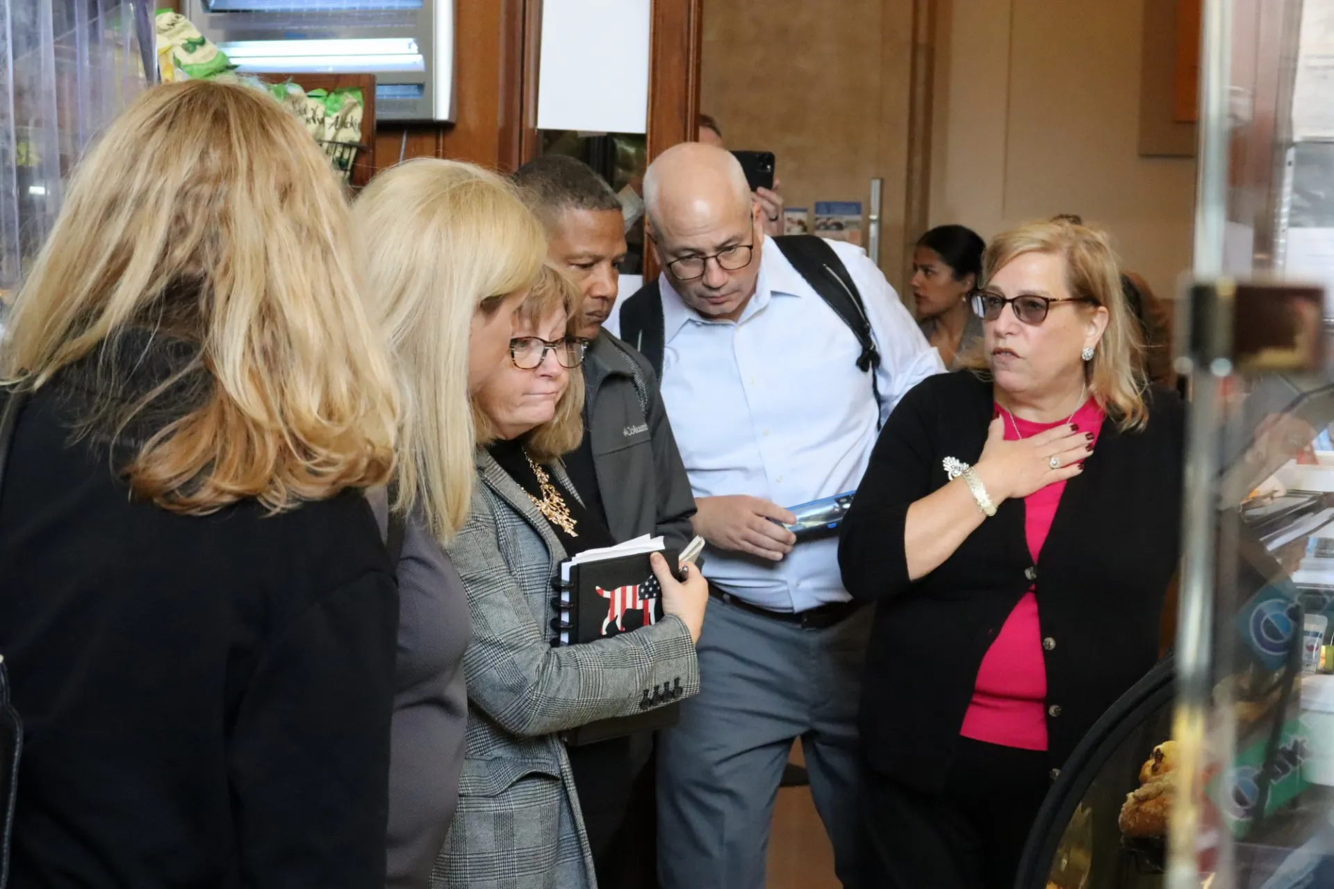 Vicki Dunn talking with a few of the representatives from the tour group
