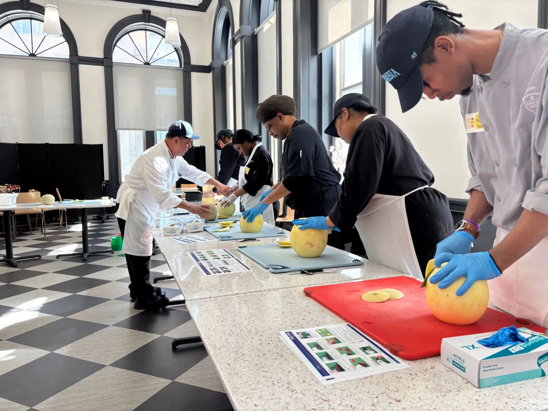 Chef Mike reviews knife skills with Dining staff in John Jay