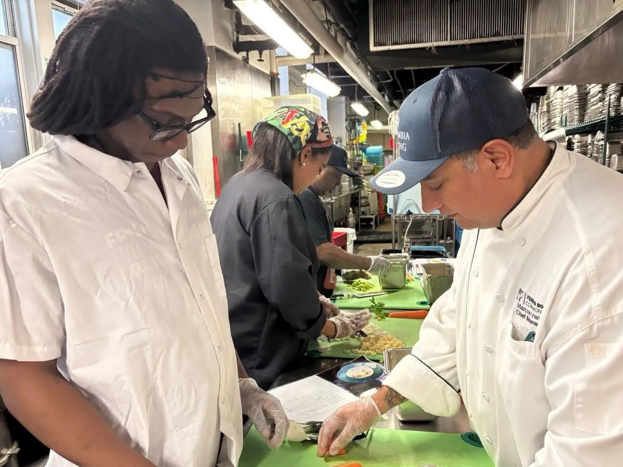 Chef Marcos helps prep ingredients for chowder 