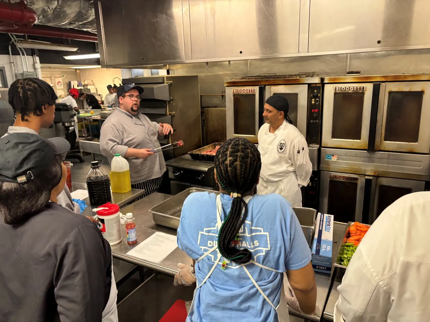 Chef Christian talks to staff