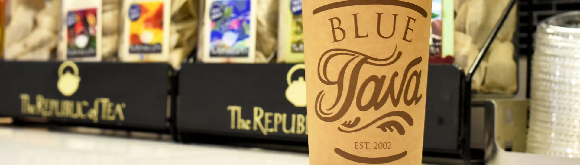 Blue Java Coffee Cup in front of Republic of Tea Stand