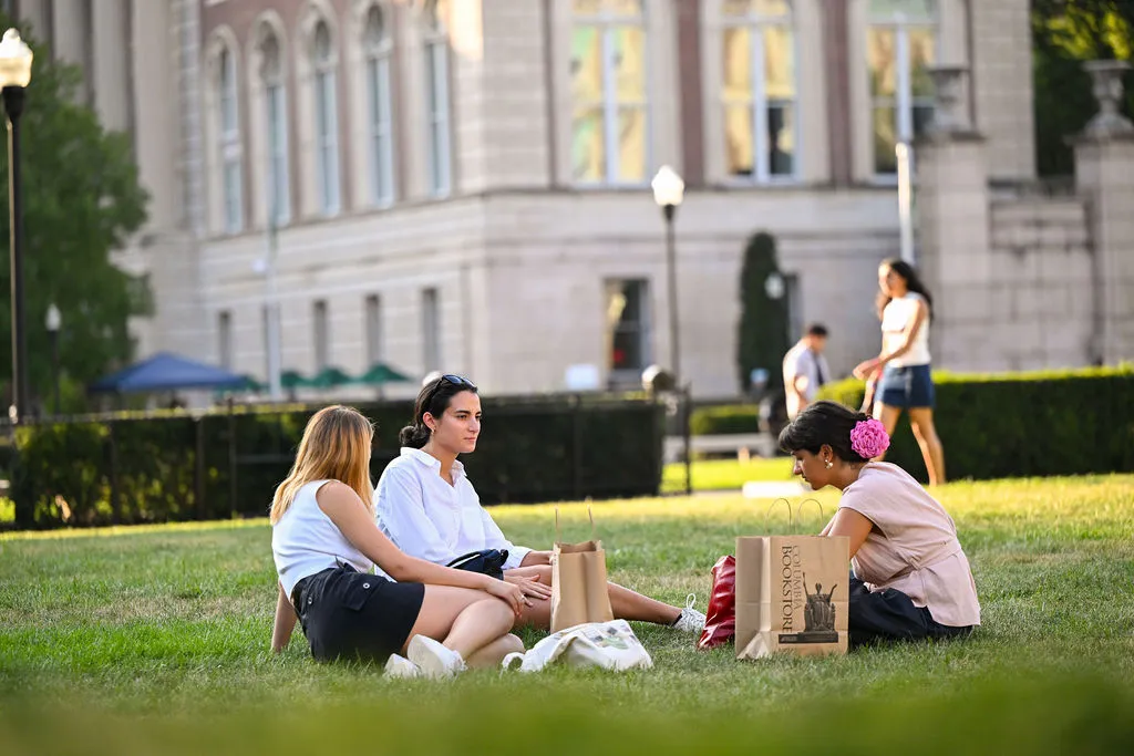 Students sitting on the lawn