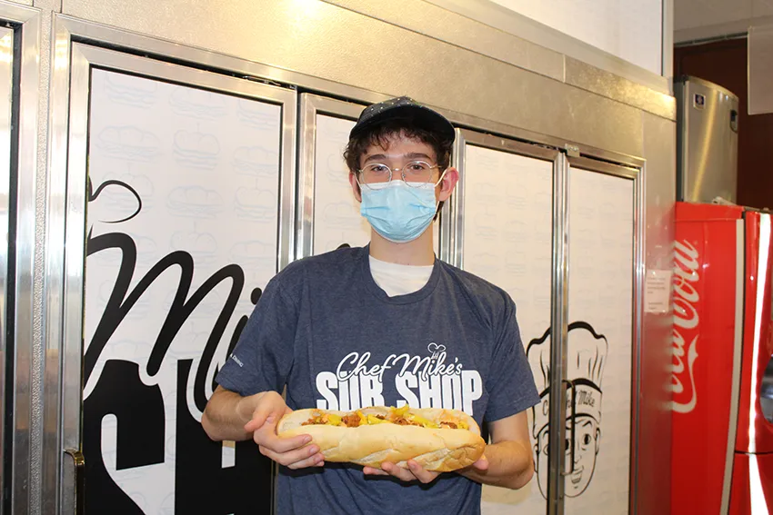 Benjamin holding the Korean BBQ rib sub