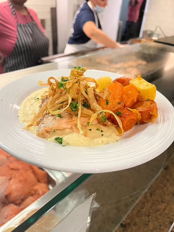 Salmon served with roasted vegetables and a celery root puree